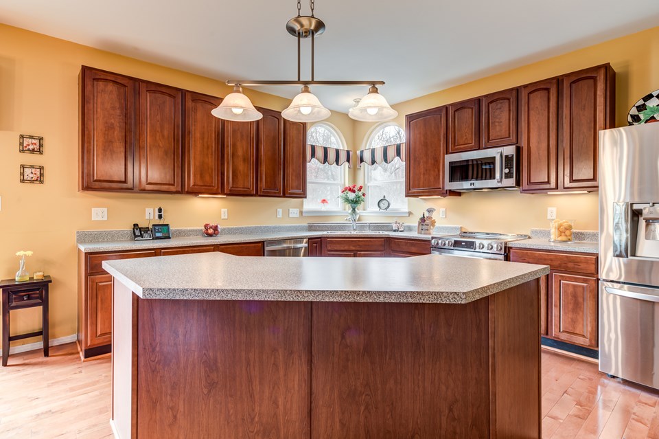chefs kitchen with stainless steel appliances