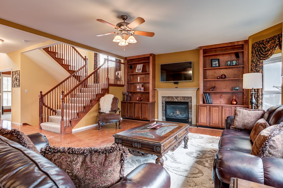 built in bookcase and hardwood floors