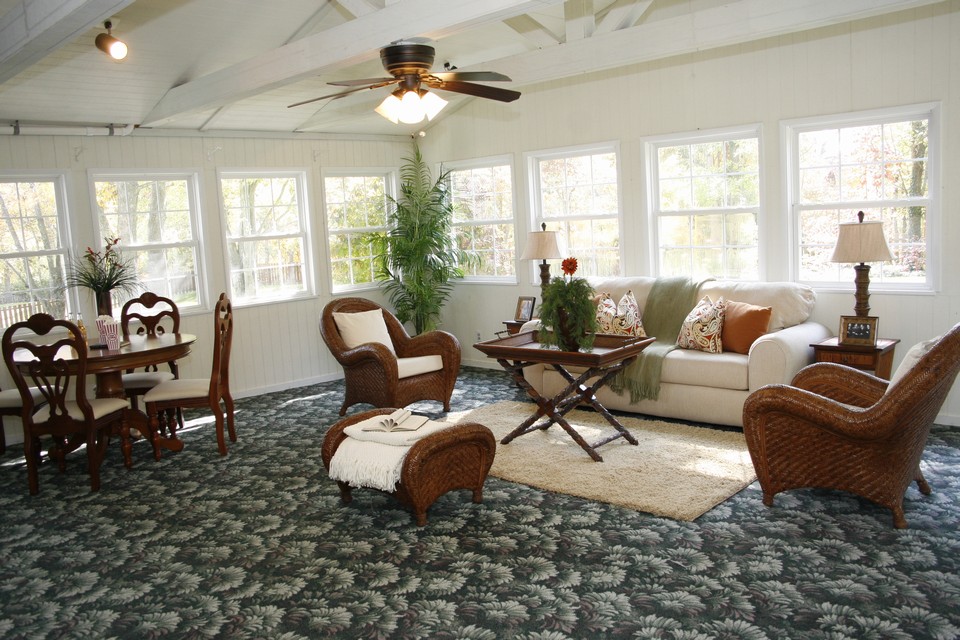 sunroom & bonus room  huge sunroom with 3 walls of windows and access to large level backyard. perfect for entertaining and offers a wetbar!